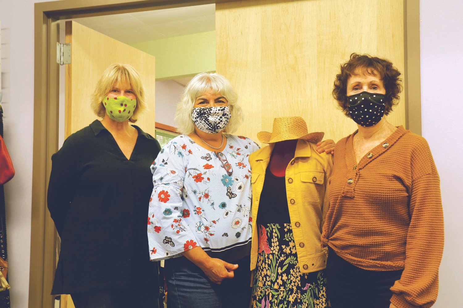 New Image Board Members, Leslie Freeman, Martha Olbrych and Jeanne Clark, from left, pose with a mannequin displaying a typical outfit curated for the nonprofit’s clients.